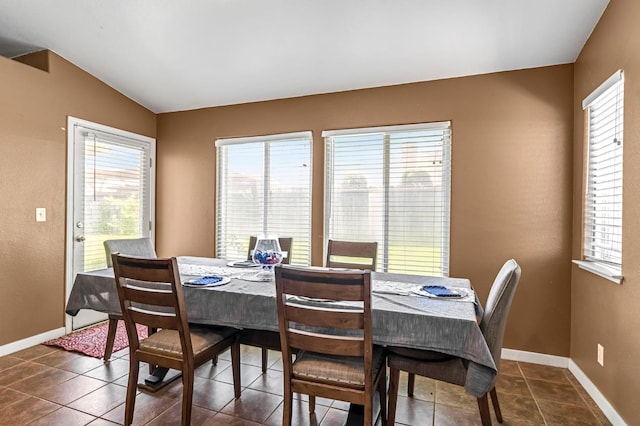 3742 Via Capitola, Madera, CA 93637 - dining room with healthy amount of natural light, vaulted ceiling, and dark tile patterned flooring