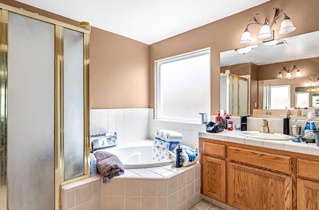 3742 Via Capitola, Madera, CA 93637 - full bath featuring vanity, a shower stall, a garden tub, and tile patterned flooring