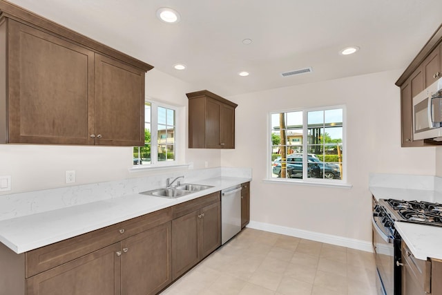63 E Florence Ave, Fresno, CA 93706 - kitchen with stainless steel appliances, light countertops, and recessed lighting