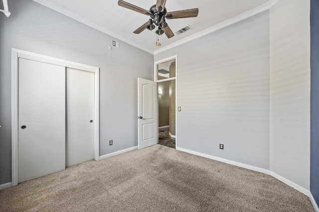 7507 N Constance Ave, Fresno, CA 93722 - unfurnished bedroom featuring ornamental molding, carpet floors, a closet, and a ceiling fan