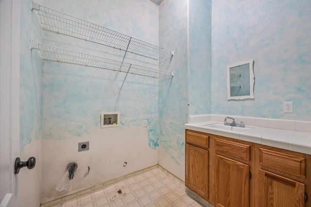 7507 N Constance Ave, Fresno, CA 93722 - laundry area with hookup for a gas dryer, hookup for an electric dryer, hookup for a washing machine, and light flooring