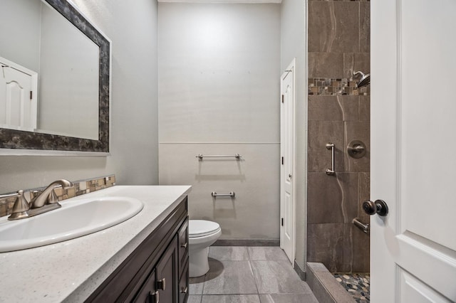 7507 N Constance Ave, Fresno, CA 93722 - bathroom featuring vanity and a tile shower