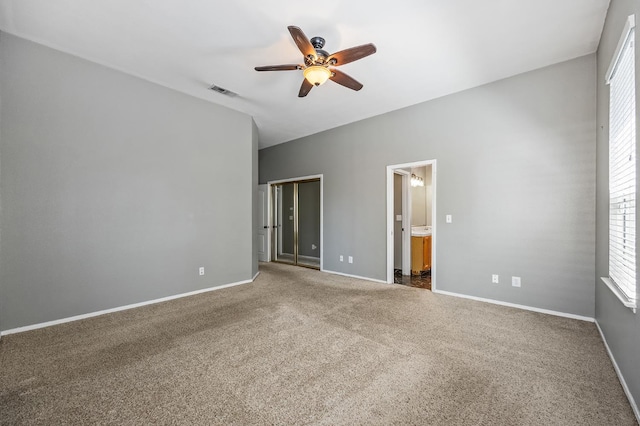 7507 N Constance Ave, Fresno, CA 93722 - unfurnished bedroom with carpet flooring, connected bathroom, and ceiling fan