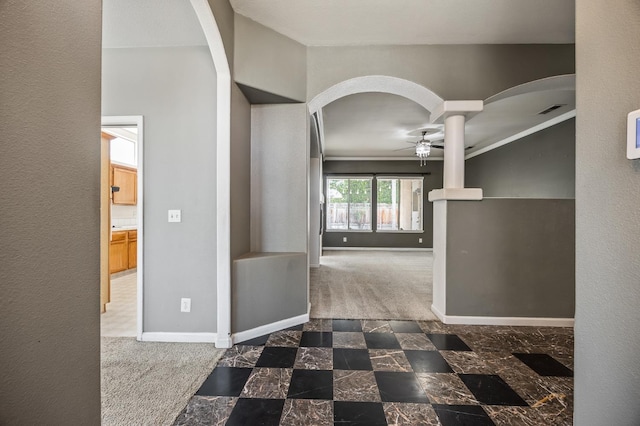 7507 N Constance Ave, Fresno, CA 93722 - hall featuring arched walkways, carpet flooring, and crown molding