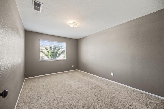 7507 N Constance Ave, Fresno, CA 93722 - empty room featuring carpet flooring and baseboards
