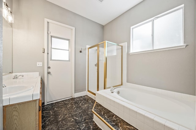 7507 N Constance Ave, Fresno, CA 93722 - full bathroom with a bath, a shower stall, double vanity, and marble look tiles