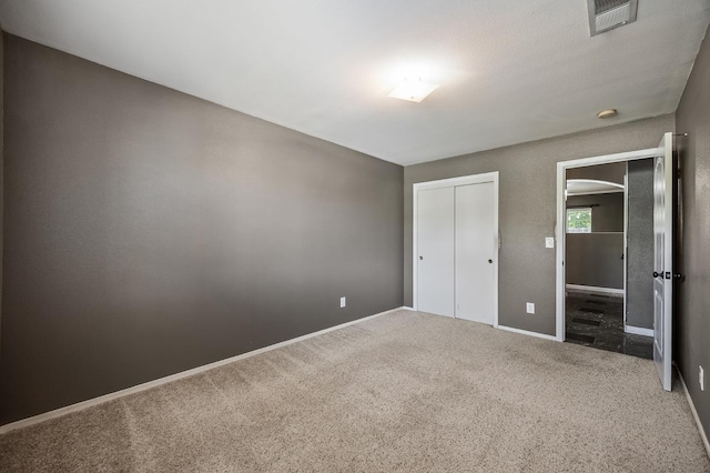 7507 N Constance Ave, Fresno, CA 93722 - unfurnished bedroom with carpet and a closet