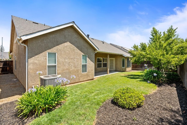 4713 W Morris Ave, Fresno, CA 93722 - back of property featuring stucco siding, a fenced backyard, and a patio area