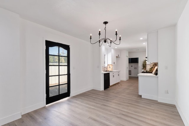 438 E Cortland Ave, Fresno, CA 93704 - unfurnished dining area featuring a chandelier, light wood-type flooring, and recessed lighting