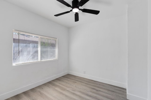 438 E Cortland Ave, Fresno, CA 93704 - empty room with a ceiling fan and light wood-style flooring