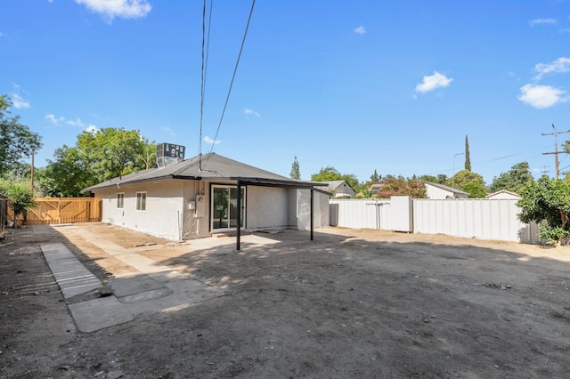 438 E Cortland Ave, Fresno, CA 93704 - rear view of house with a fenced backyard and a patio area