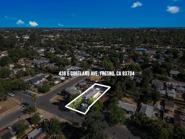 438 E Cortland Ave, Fresno, CA 93704 - aerial view of property and surrounding area with property parcel outlined and nearby suburban area