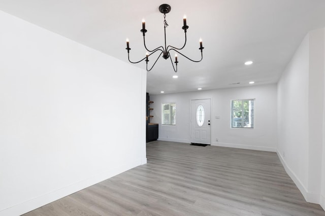 438 E Cortland Ave, Fresno, CA 93704 - foyer featuring a chandelier, recessed lighting, plenty of natural light, and light wood-style floors