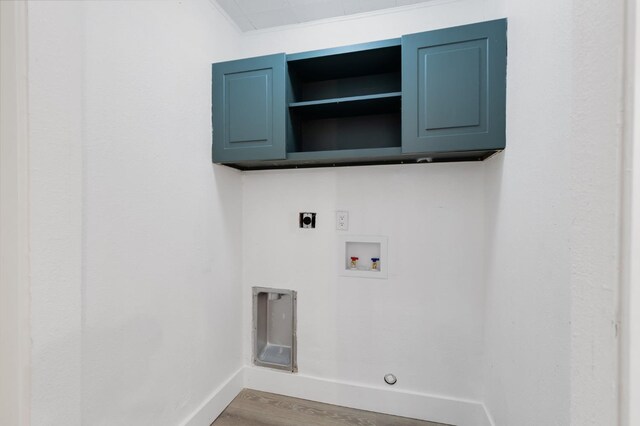 438 E Cortland Ave, Fresno, CA 93704 - washroom featuring wood finished floors, electric dryer hookup, cabinet space, and washer hookup