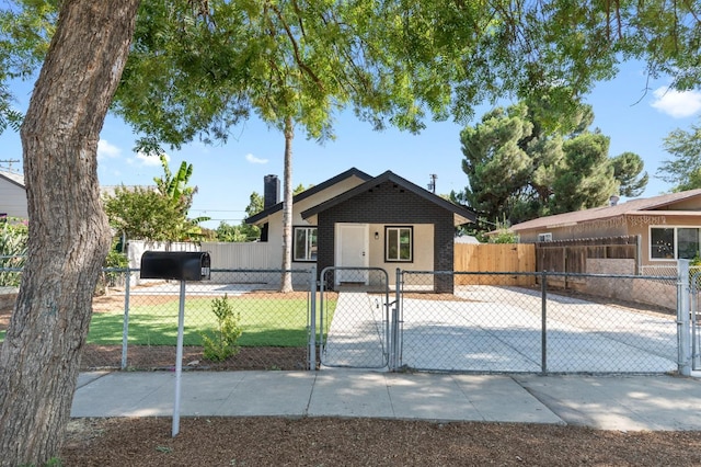 438 E Cortland Ave, Fresno, CA 93704 - view of front of house featuring a gate and brick siding