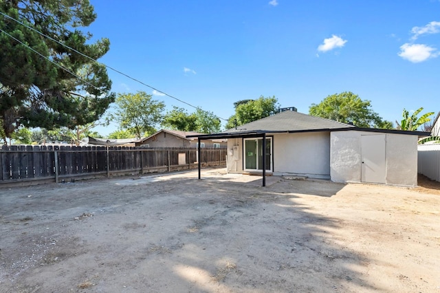 438 E Cortland Ave, Fresno, CA 93704 - back of house with a fenced backyard and stucco siding