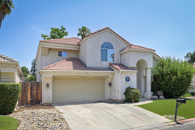 9544 N Whitehouse Dr, Fresno, CA 93720 - mediterranean / spanish-style home featuring a tiled roof, driveway, and stucco siding