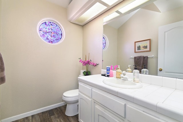 9544 N Whitehouse Dr, Fresno, CA 93720 - half bath with vanity, wood finished floors, and vaulted ceiling