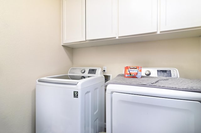 9544 N Whitehouse Dr, Fresno, CA 93720 - washroom with washer and clothes dryer and cabinet space