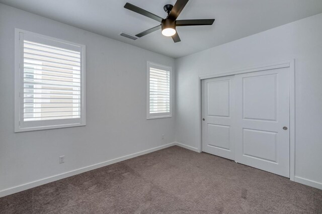 4670 Terrace Rd, Madera, CA 93636 - unfurnished bedroom with carpet flooring, a closet, and a ceiling fan