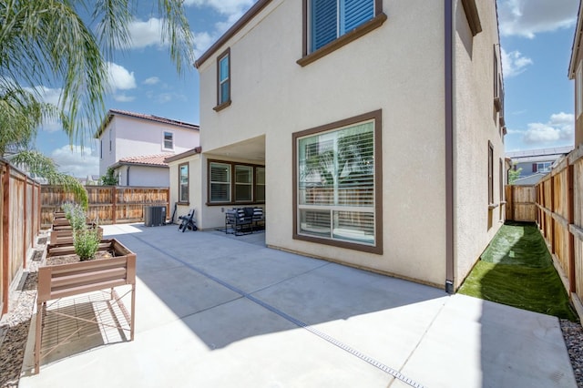 4670 Terrace Rd, Madera, CA 93636 - rear view of house featuring a patio, stucco siding, and a fenced backyard