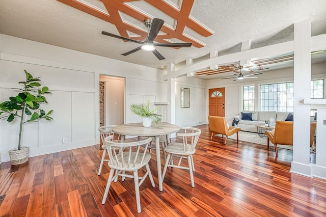 730 E Yale Ave, Fresno, CA 93704 - dining space with ceiling fan, wood finished floors, a decorative wall, and a textured ceiling