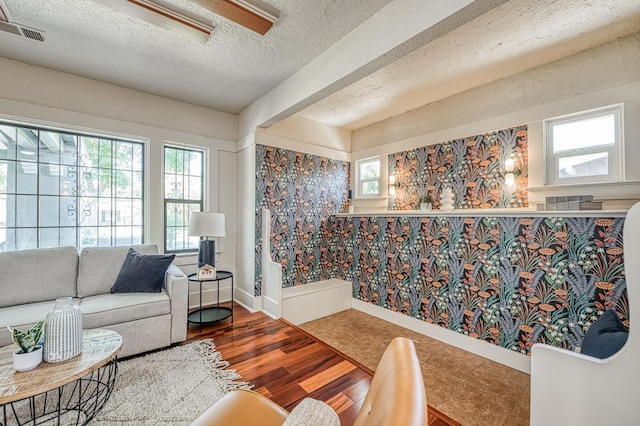 730 E Yale Ave, Fresno, CA 93704 - living room featuring a textured ceiling and wood finished floors