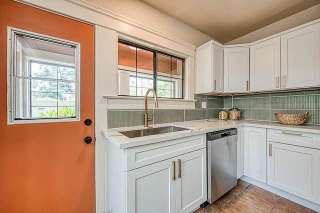 730 E Yale Ave, Fresno, CA 93704 - kitchen with dishwasher, backsplash, light countertops, white cabinets, and tile patterned flooring