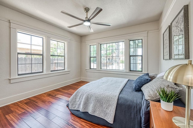 730 E Yale Ave, Fresno, CA 93704 - bedroom featuring wood finished floors, a textured ceiling, and ceiling fan