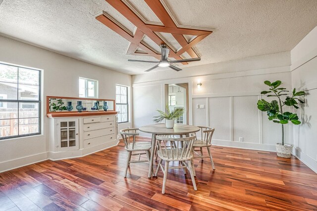 730 E Yale Ave, Fresno, CA 93704 - dining space featuring a textured ceiling, wood finished floors, a decorative wall, and ceiling fan
