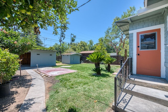 730 E Yale Ave, Fresno, CA 93704 - fenced yard with a storage unit and a patio
