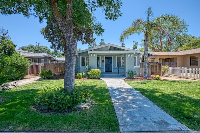 730 E Yale Ave, Fresno, CA 93704 - bungalow-style house with a gate, a porch, and stucco siding