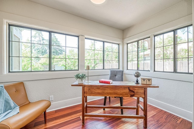 730 E Yale Ave, Fresno, CA 93704 - office area featuring wood finished floors and a textured wall