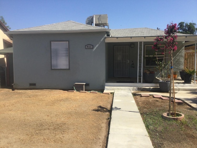 411 E Fountain Way, Fresno, CA 93704 - view of front of house with roof with shingles, crawl space, and stucco siding