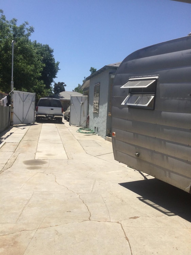 411 E Fountain Way, Fresno, CA 93704 - view of side of property with concrete driveway