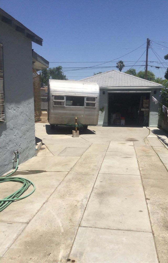 411 E Fountain Way, Fresno, CA 93704 - detached garage featuring concrete driveway