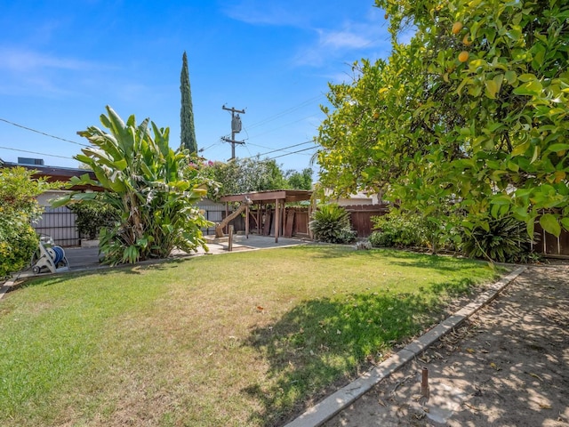 4629 N Fisher St, Fresno, CA 93726 - fenced backyard with a patio area