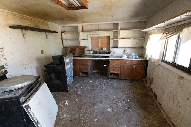 1603 Faller Ave, Sanger, CA 93657 - kitchen with open shelves, brown cabinets, and light countertops