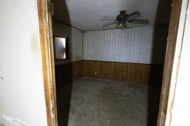 1603 Faller Ave, Sanger, CA 93657 - spare room with a ceiling fan, a wainscoted wall, and wood walls