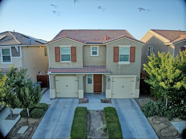 3869 Griffith Ave, Clovis, CA 93619 - view of front of house with a tiled roof, stucco siding, and concrete driveway