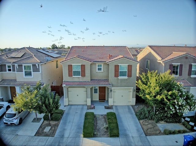 3869 Griffith Ave, Clovis, CA 93619 - view of front of property with a tiled roof, a garage, stucco siding, driveway, and a residential view