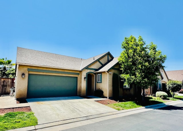 4074 Heritage Ln, Clovis, CA 93619 - view of front of home with an attached garage, concrete driveway, and stucco siding