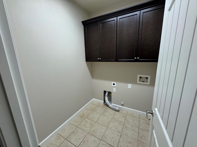 4074 Heritage Ln, Clovis, CA 93619 - laundry room featuring electric dryer hookup, washer hookup, hookup for a gas dryer, cabinet space, and light tile patterned floors