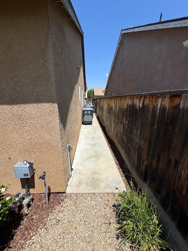 4074 Heritage Ln, Clovis, CA 93619 - view of home's exterior featuring stucco siding, a fenced backyard, and a patio