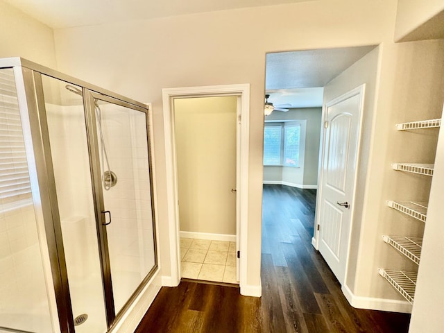 4074 Heritage Ln, Clovis, CA 93619 - bathroom featuring wood finished floors, a shower stall, and ceiling fan