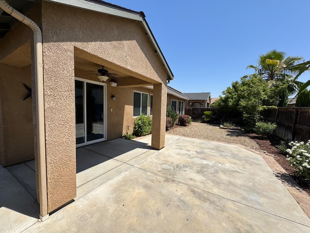 4074 Heritage Ln, Clovis, CA 93619 - fenced backyard featuring a ceiling fan and a patio area