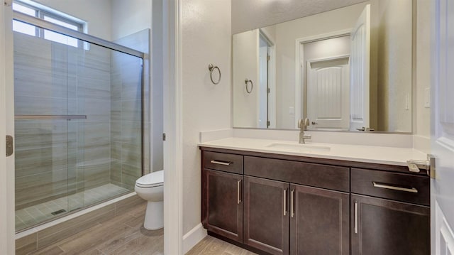 925 Talus Way S, Madera, CA 93636 - bathroom featuring vanity, a shower stall, and wood finished floors