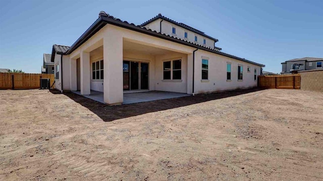 925 Talus Way S, Madera, CA 93636 - back of property with a patio, stucco siding, a fenced backyard, and a tiled roof