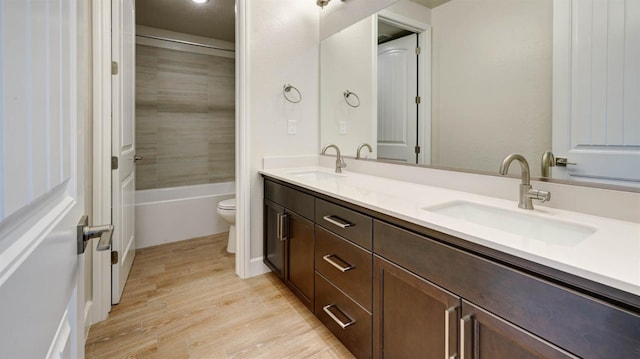 925 Talus Way S, Madera, CA 93636 - full bath with double vanity, wood finished floors, and tub / shower combination