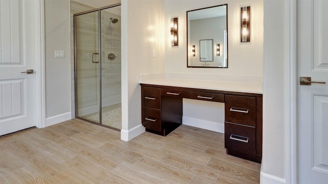 925 Talus Way S, Madera, CA 93636 - full bath featuring vanity, a stall shower, and wood finished floors